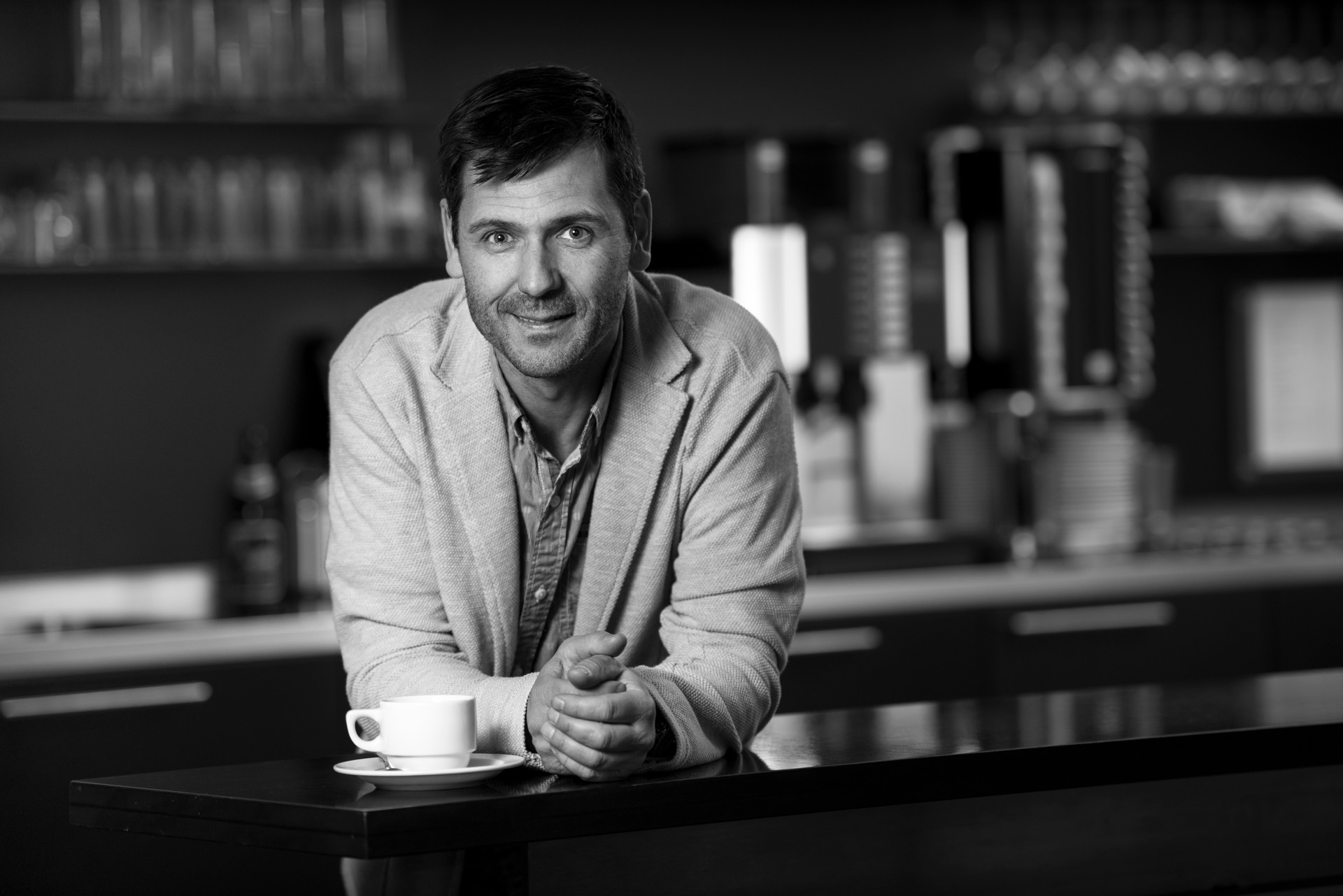 Smiling man drinking coffee