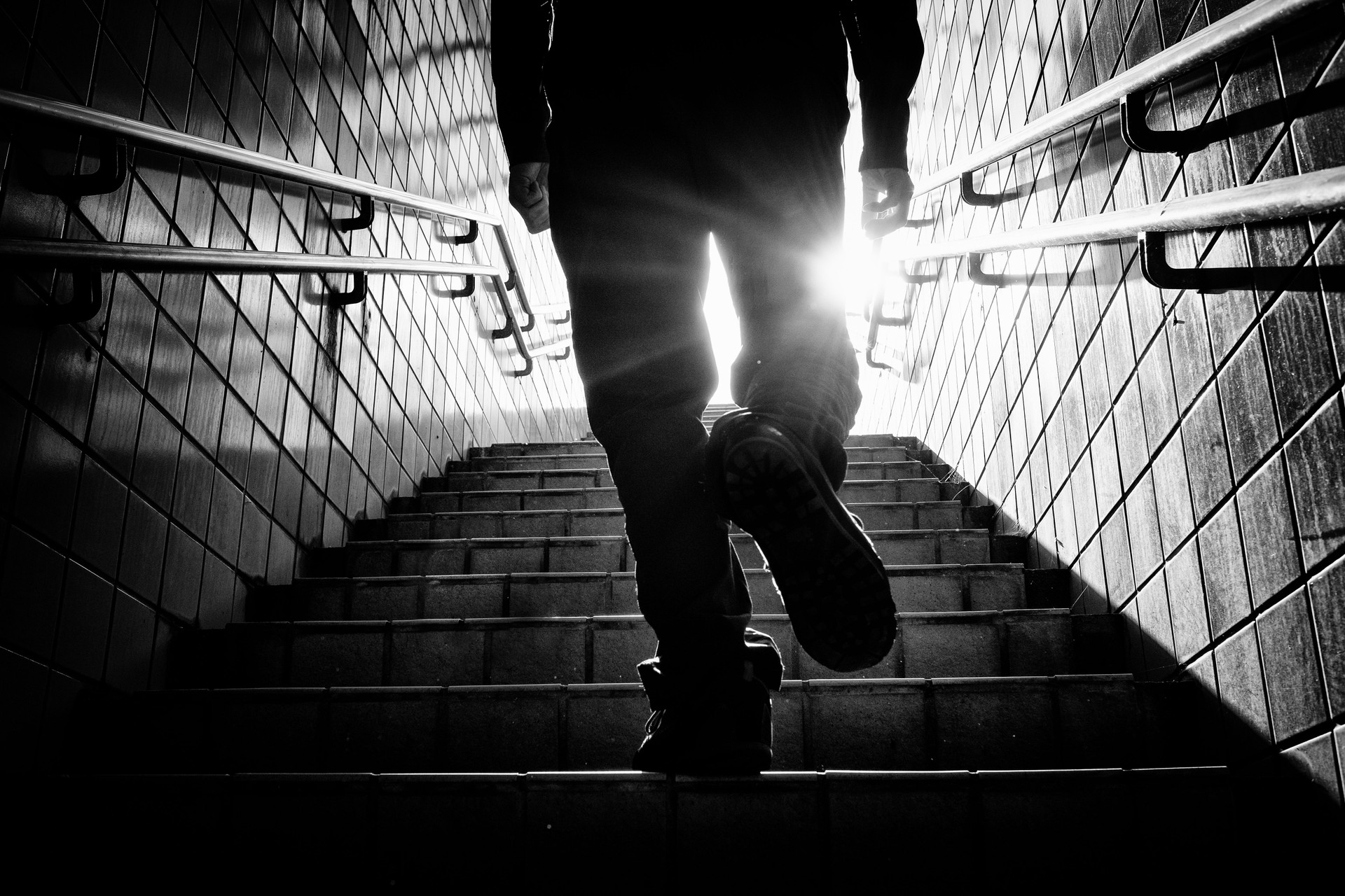 Image of silhouette of a man climbing stairs